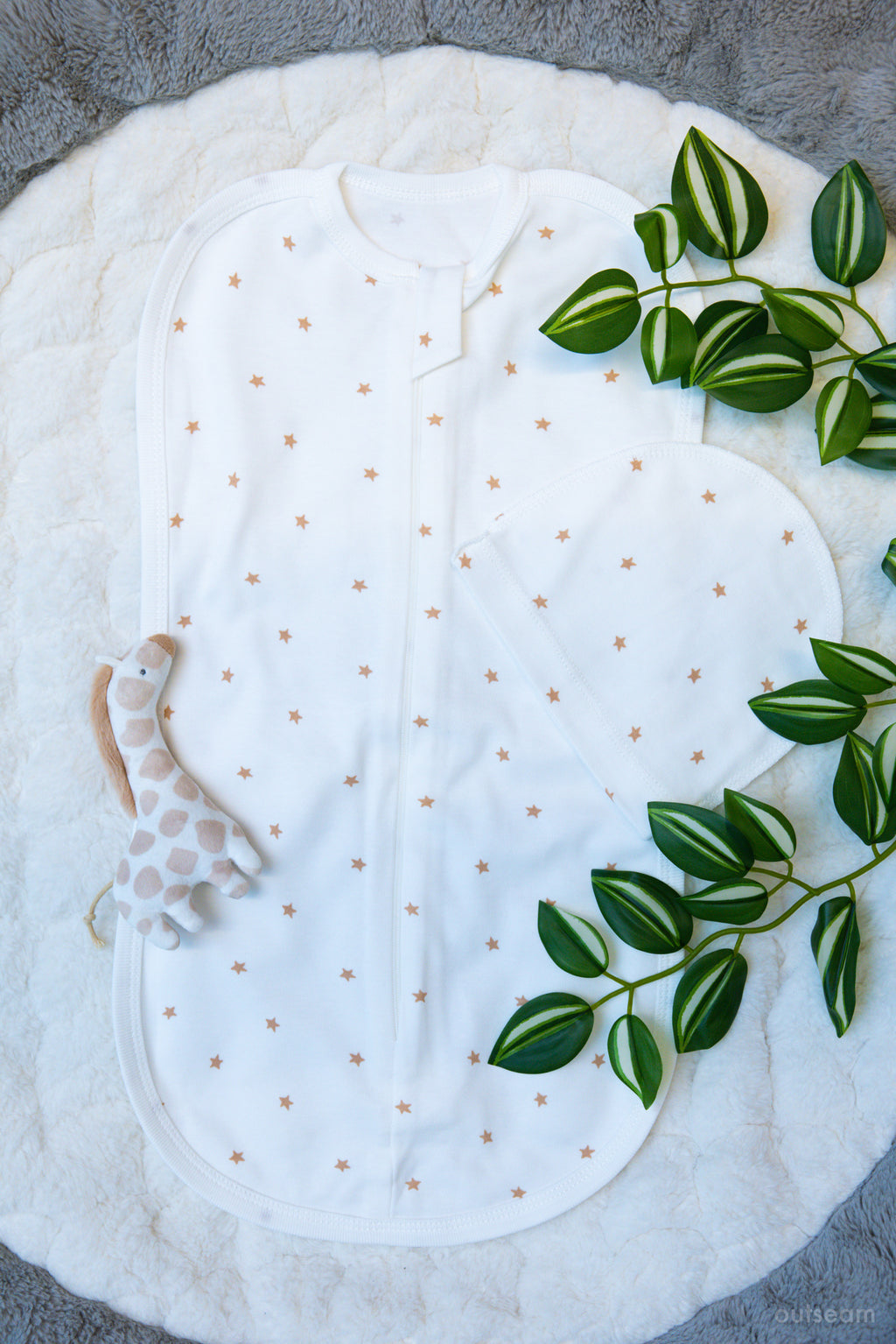 Outseam Newborn Sleep Cocoon - Brown Stars — soft cotton baby sleep cocoon with outward seams